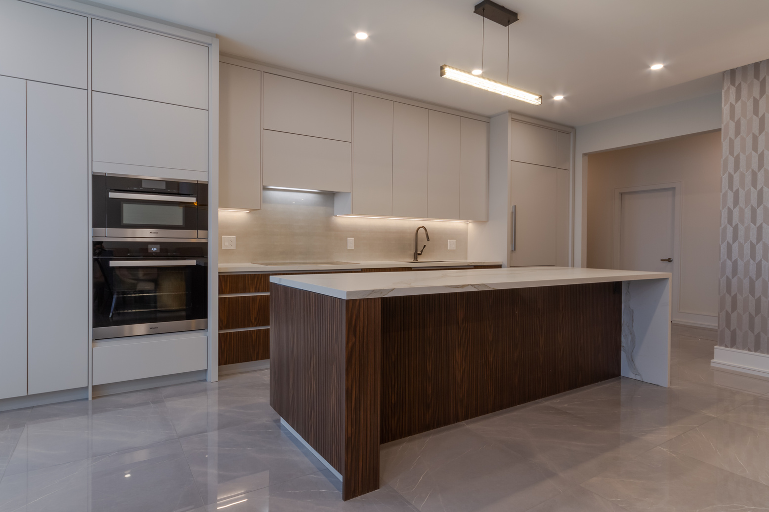 Contemporary Bayview Residence kitchen with custom cabinetry and a large central island