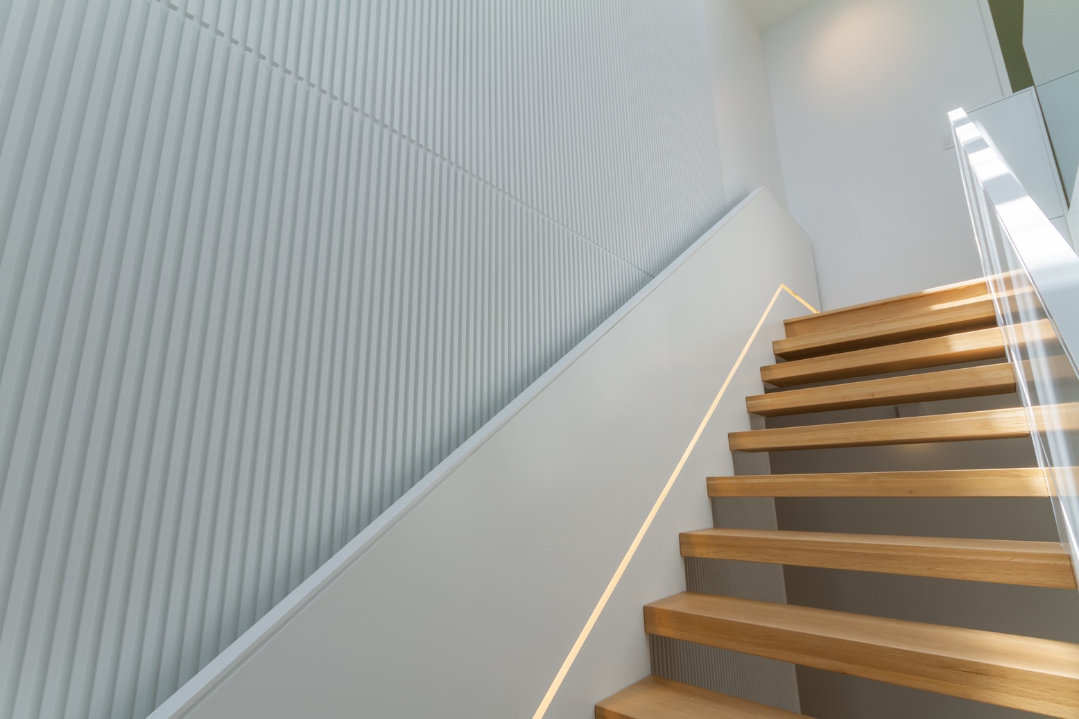 Finished interior reconfiguration with a floating oak staircase