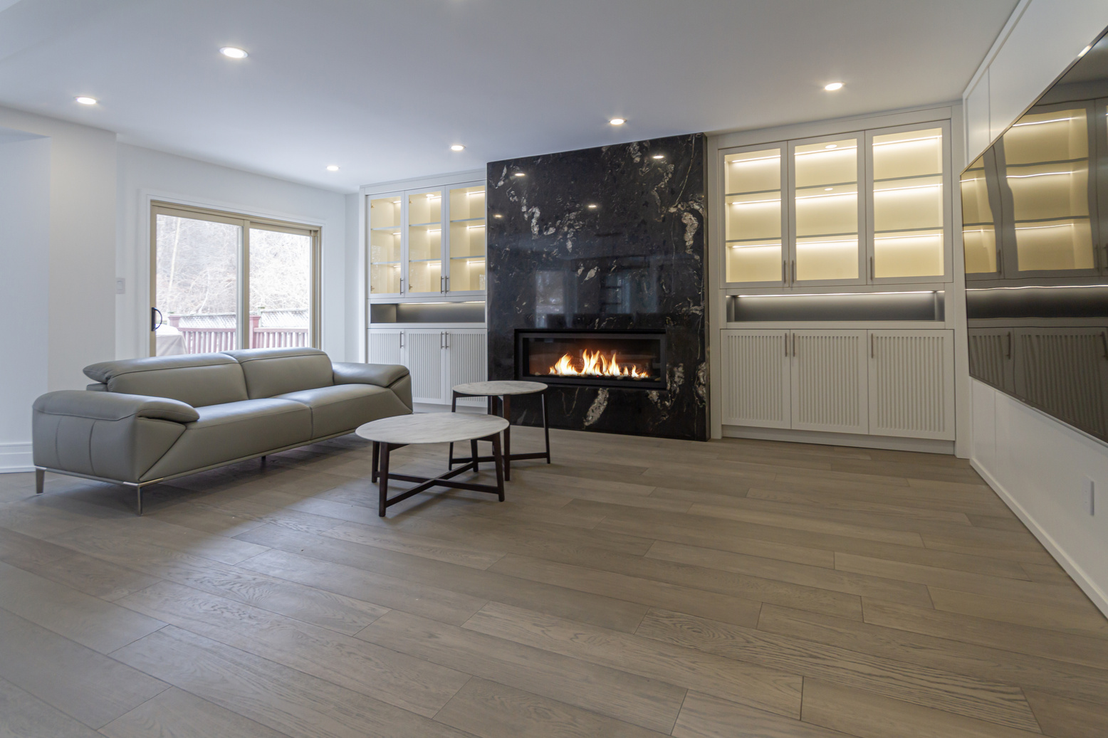 Finished Wilfred Court living space with custom built-ins and warm wood details